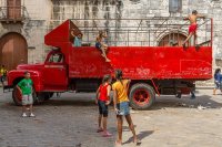 Red truck, children playing, Havana, Cuba 2013 Red truck, children playing, Havana, Cuba 2013