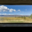 view through a slightly dirty window onto a desert grassland landscape
